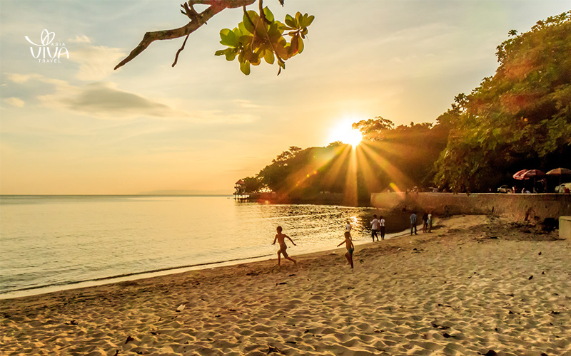 Catch the stunning sunset at the pier, where vibrant colors reflect on the calm waters of Kep