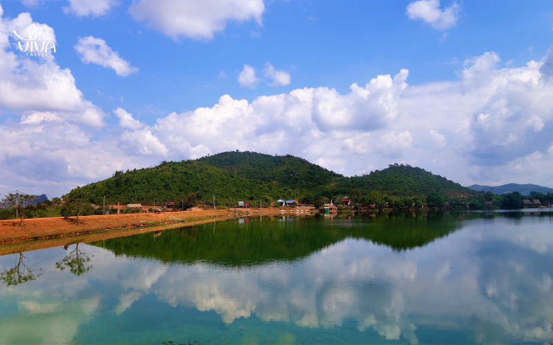 The tranquil Kampot River, lined with lush greenery, offers the perfect setting for peaceful boat rides and picturesque sunsets