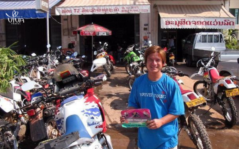 Rent a motorbike and explore Laos' scenic roads for an unforgettable adventure