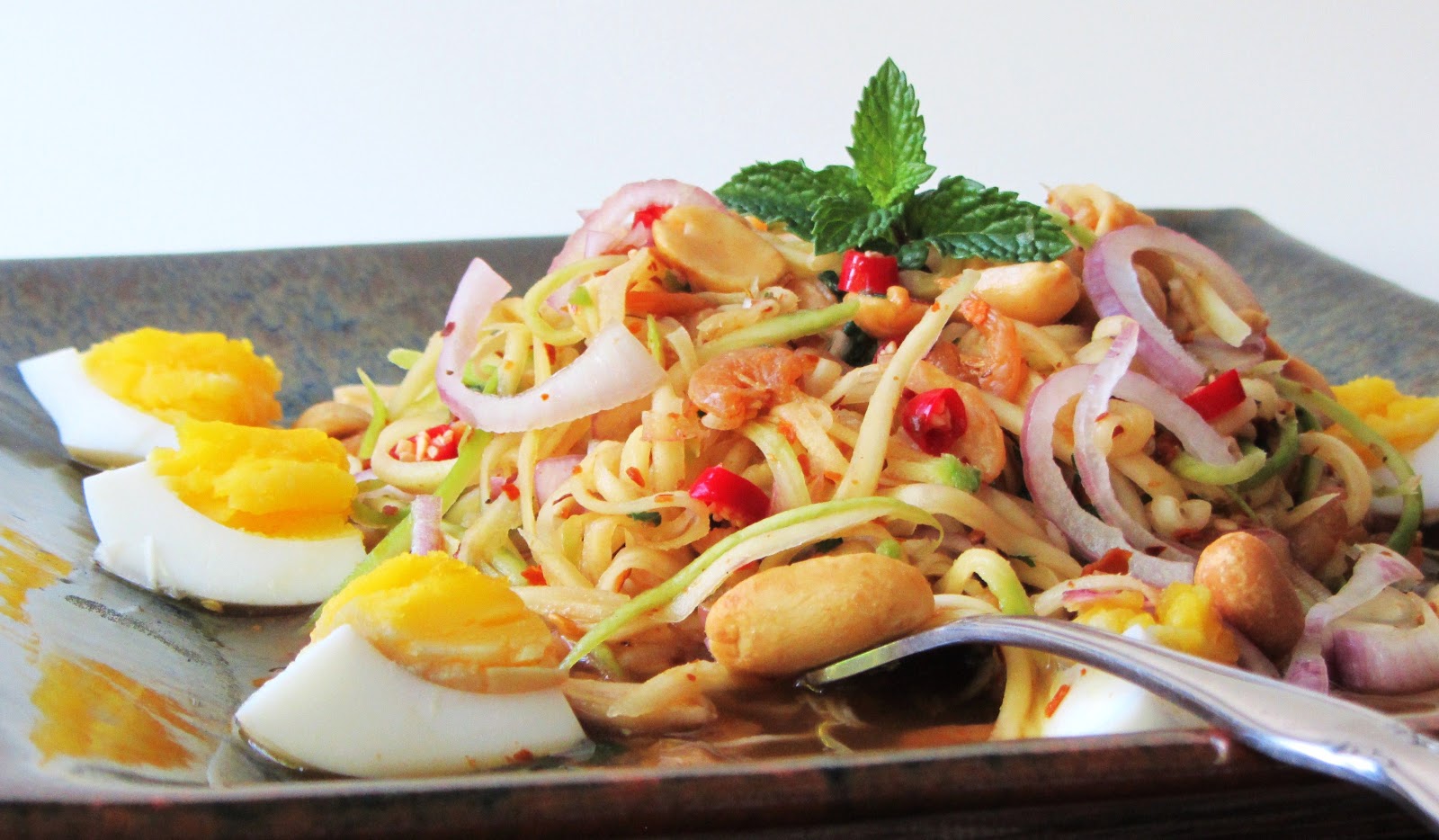 Tum Ma Muang (Spicy Green Mango Salad) - Thailand food
